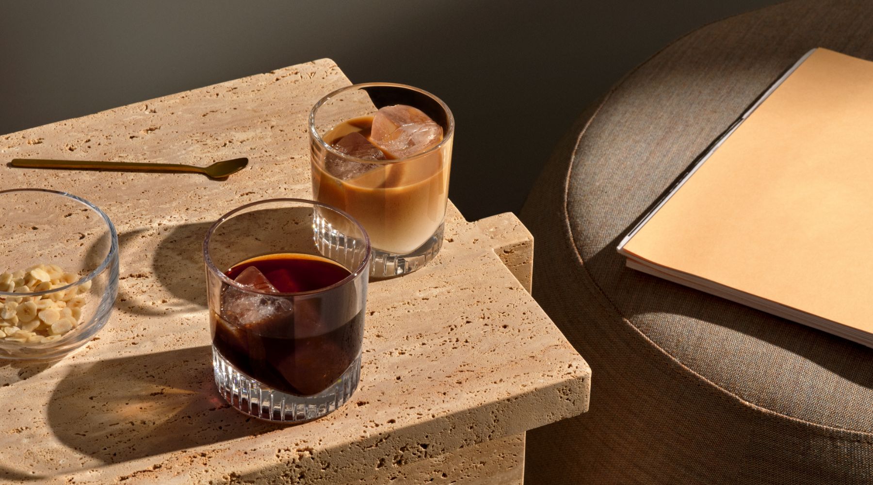 NUDE Caldera whisky glasses presented with a coffee drink and coffee with milk drink