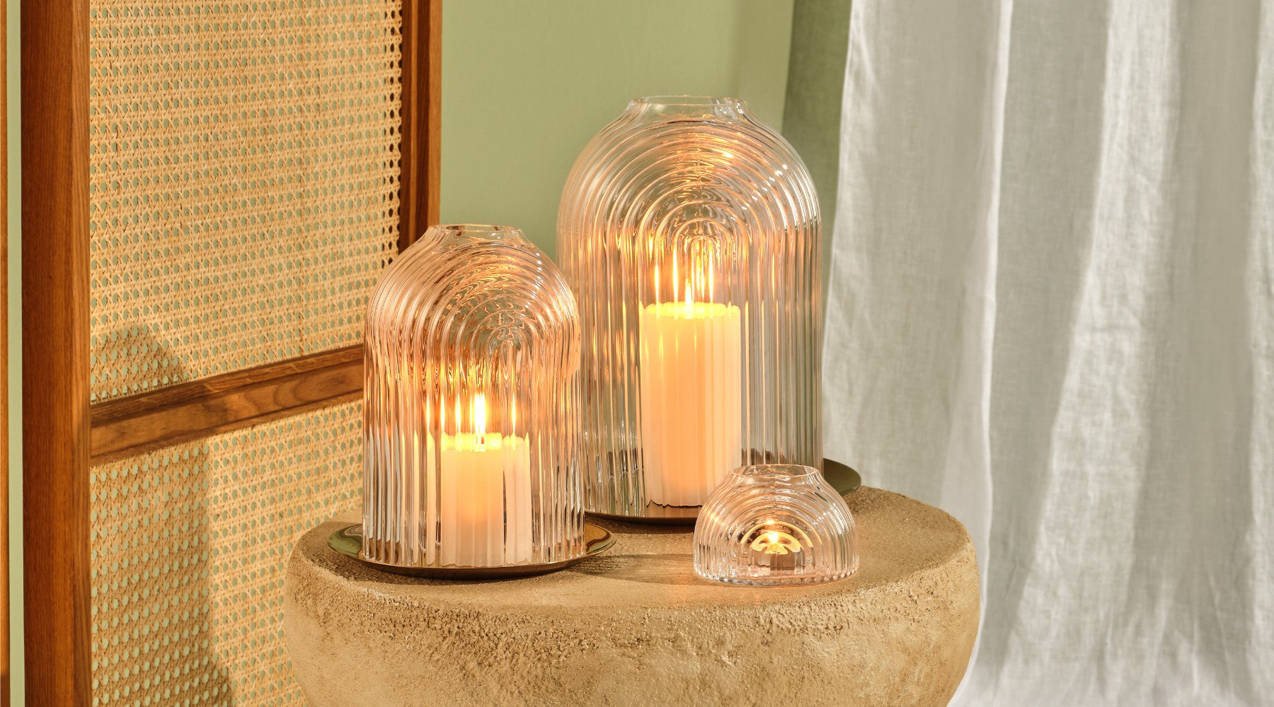 NUDE Ilo collection of 2 sizes candle holders and a votive with its typical ribbed glass effect