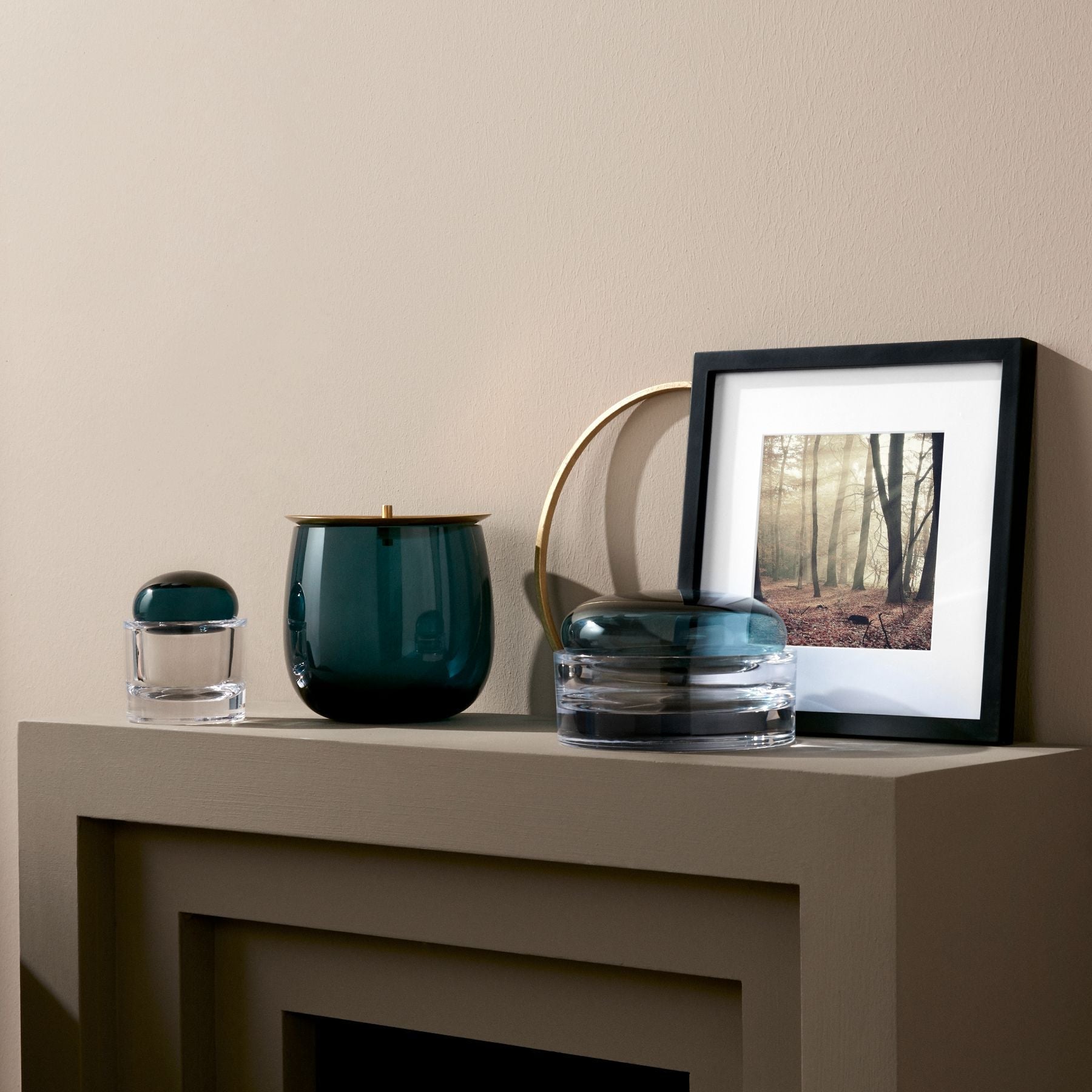NUDE Beret and Ecrin lidded storage box collections in clear and coloured glass on neutral background