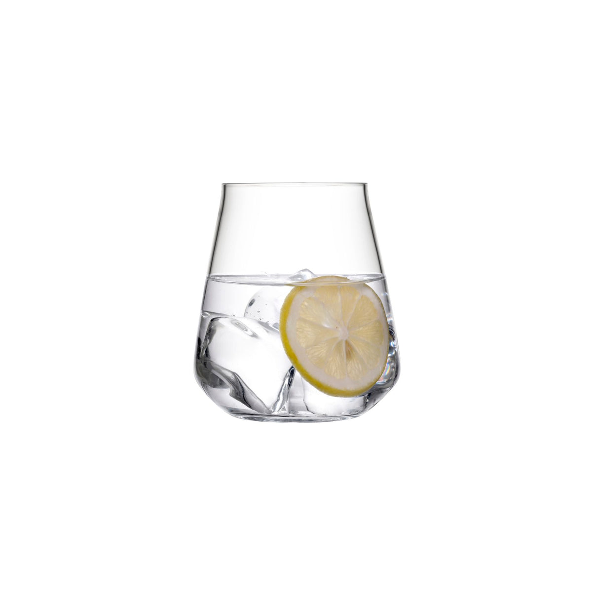 NUDE Salute lead-free crystal tumbler filled with water, ice and a lemon slice on a white background