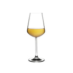NUDE Salute white wine glass filled with white wine, lead-free crystal with a tapered rim on a white background