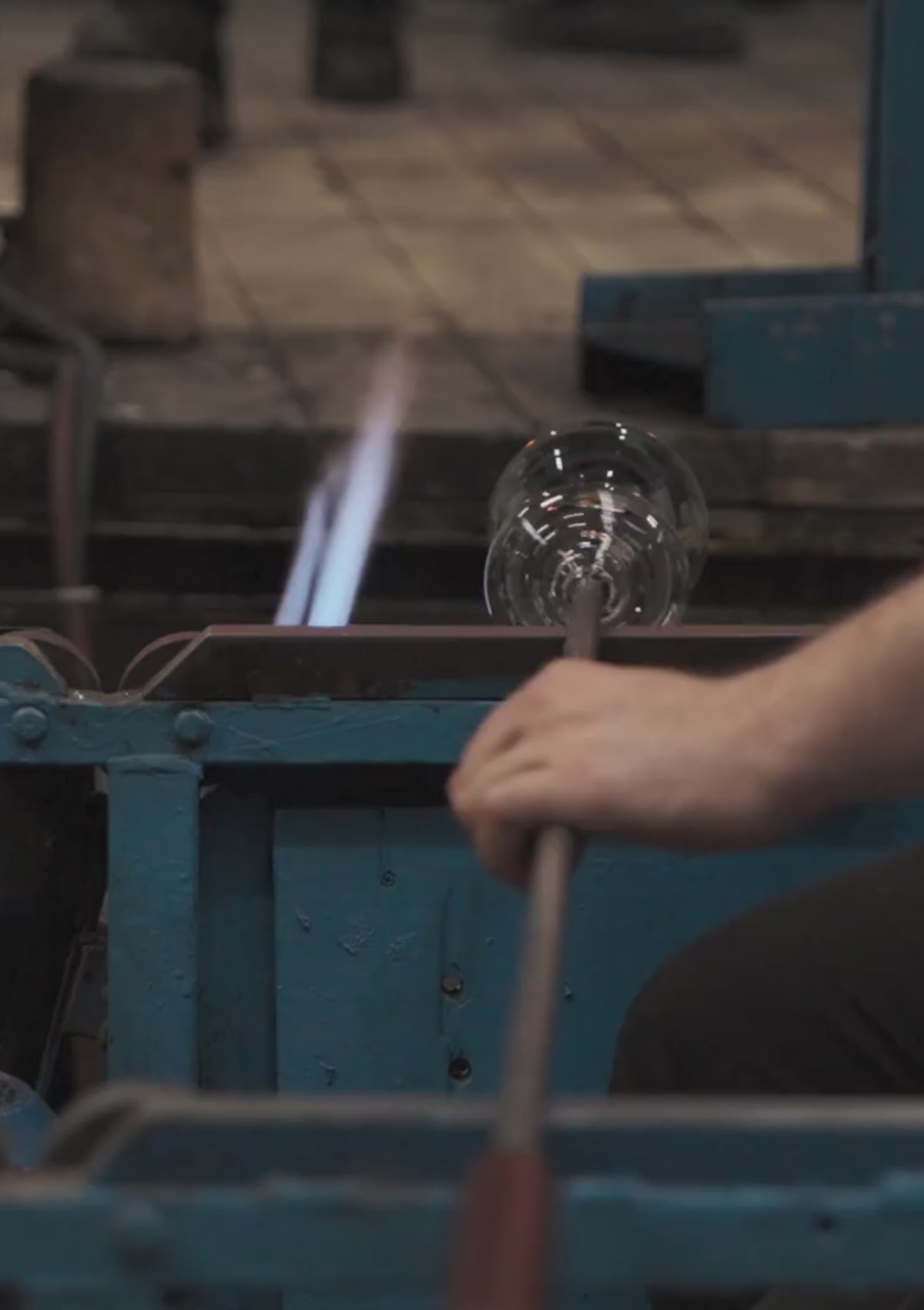 Glassblower in the Şişecam glass factory creating the handmade Stem Zero Volcano glasses.. 