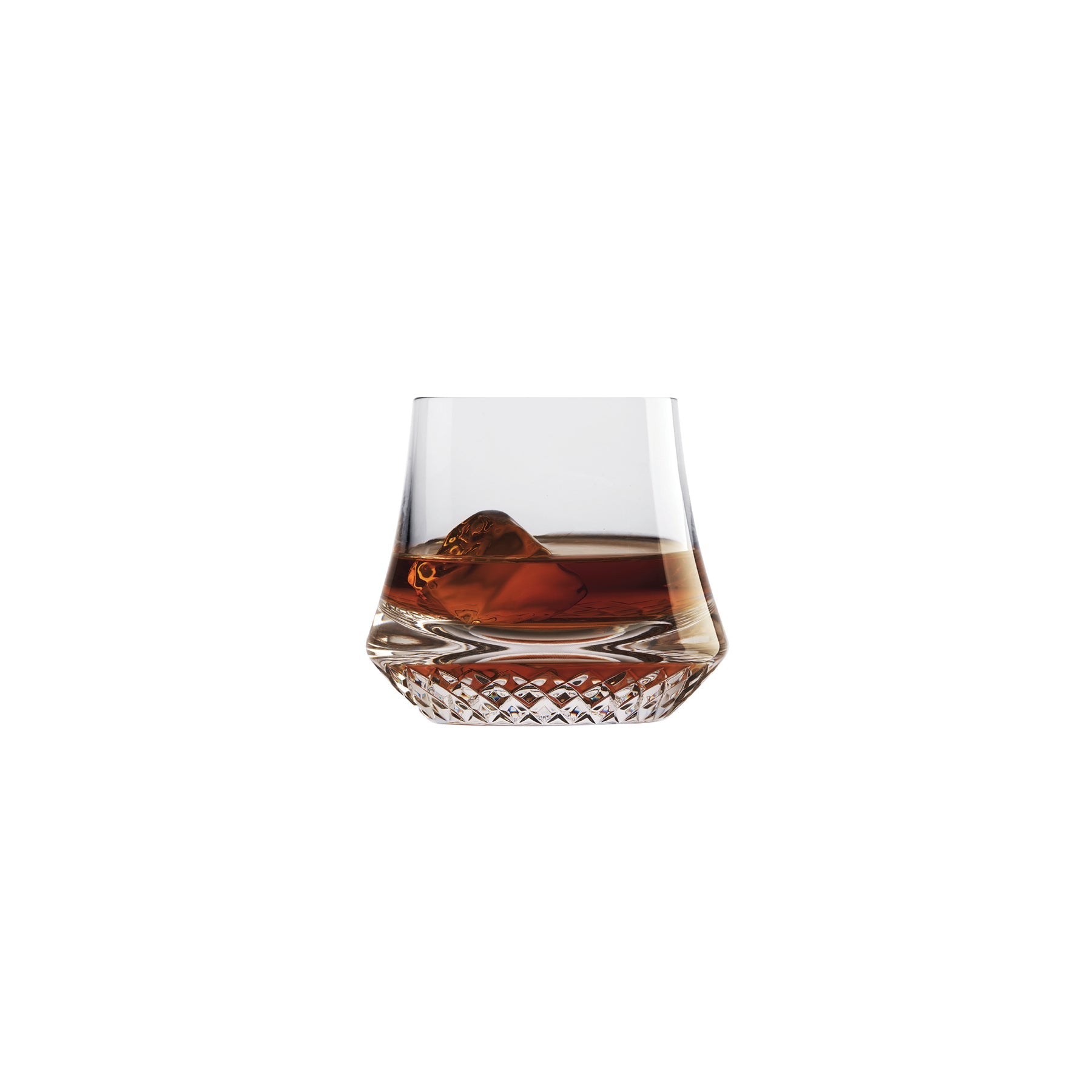 NUDE Paris whisky glass DOF, presented filled with whisky on a white background