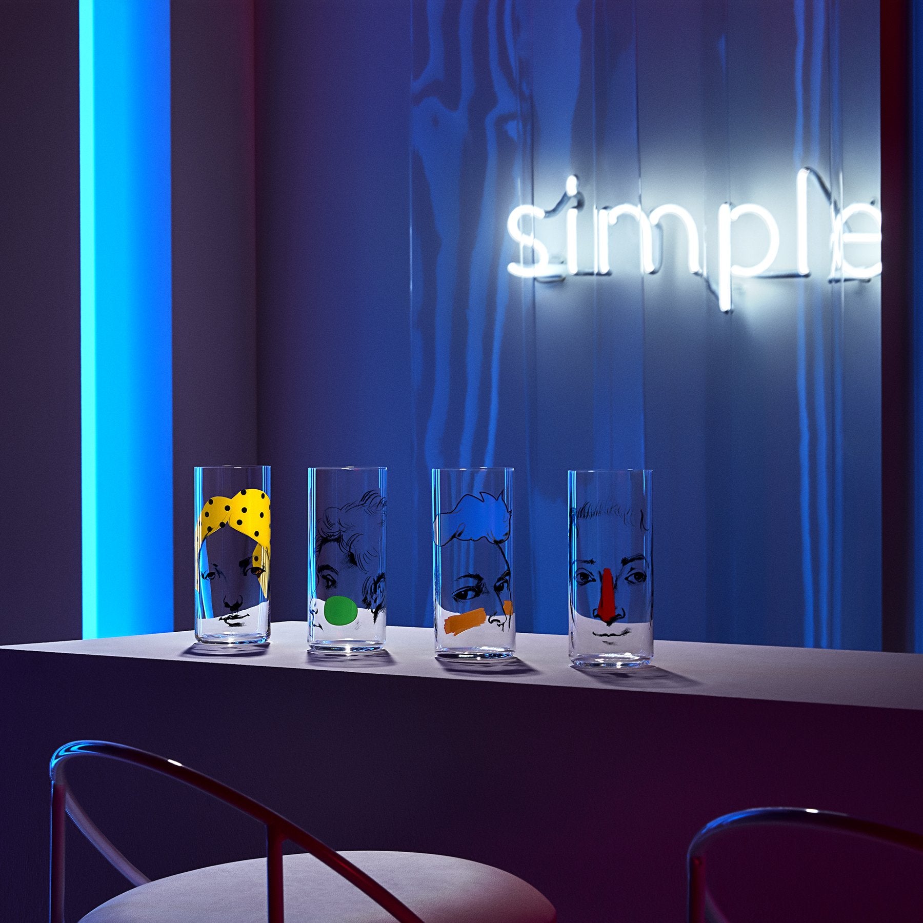Lifestyle image of NUDE Rock &amp; Pop high ball glasses in neon environment