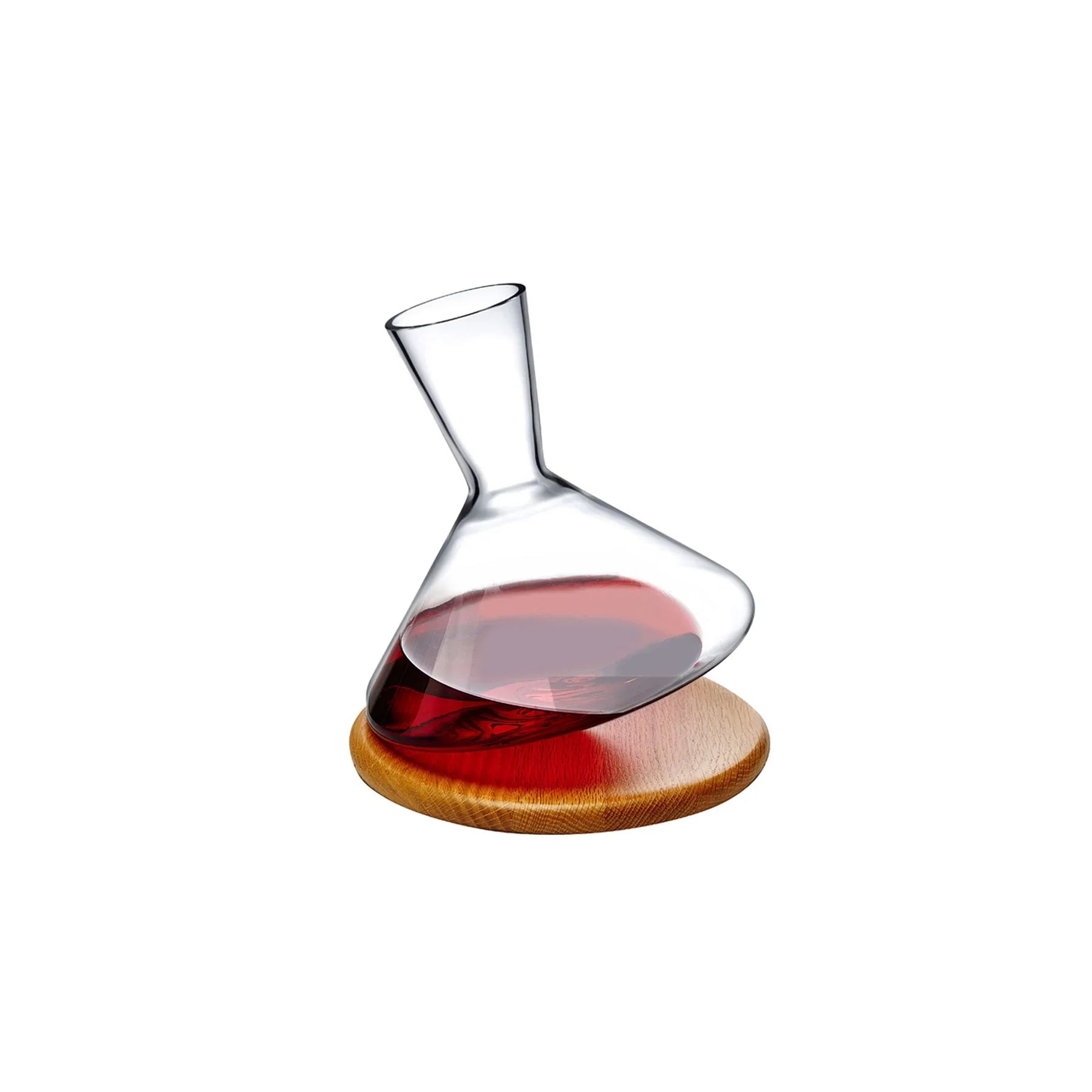 Wine decanter with red wine on a wooden coaster against a white background