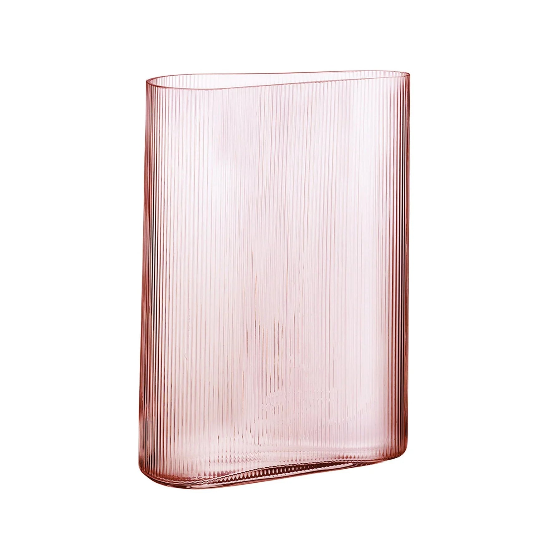 Pink glass vase with ribbed texture on a white background